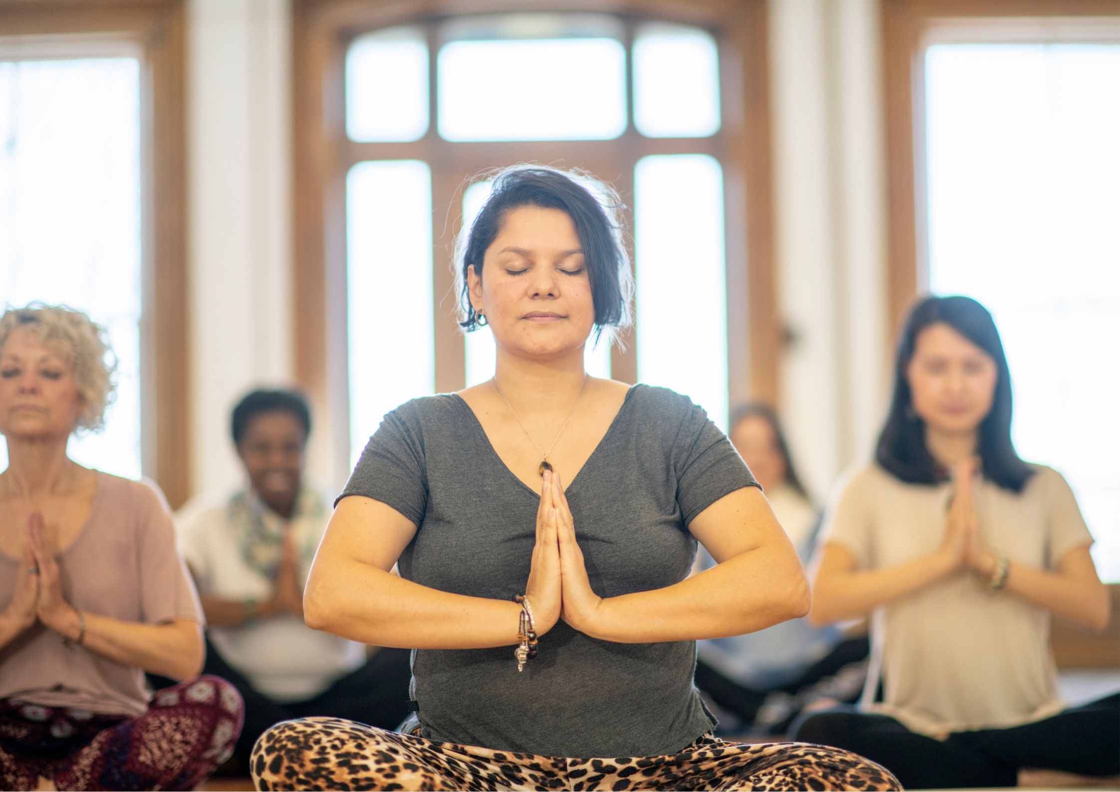 A diverse group sharing a seated meditation practice
