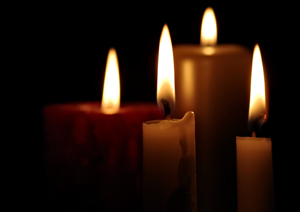 Warm candlelight creating a restful atmosphere for sound healing